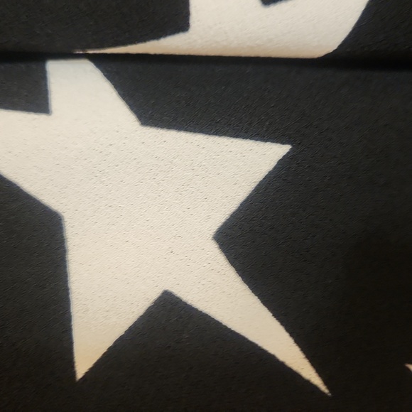 LulaRoe black and white skirt filled with stars. Size small but can fit … - Picture 2 of 5